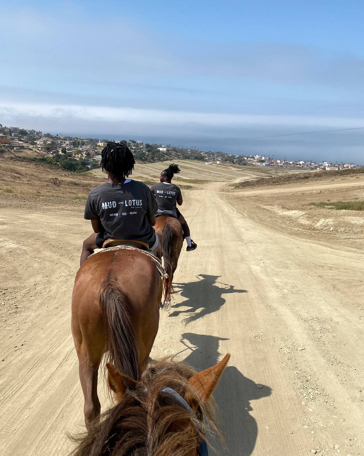 Riders on a coastal trail